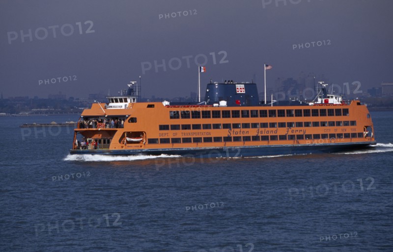 USA, New York, New York City, Staten Island ferry with city skyline beyond.