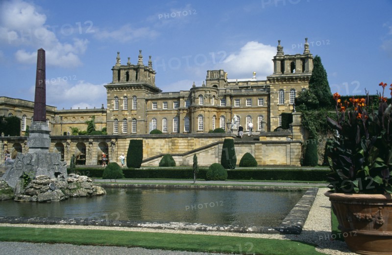 ENGLAND, Oxfordshire, Woodstock, Blenheim Palace. View across formal gardens towards the Bernini Fountain