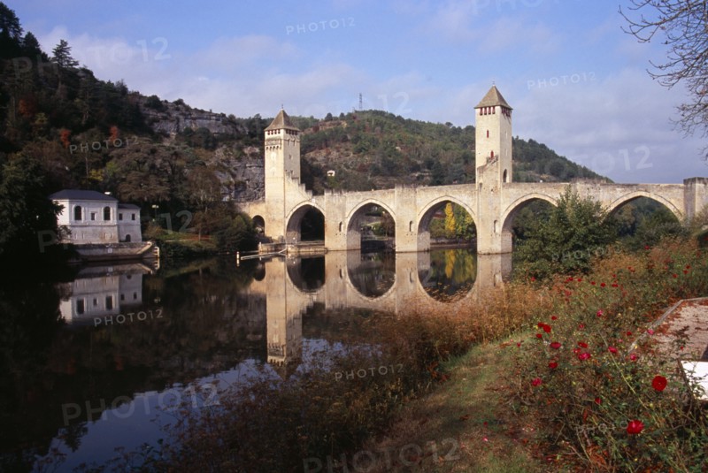 FRANCE, Midi Pyrenees, Cahors, Pont Valentre. Bridge over the River Lot built between 1308 and 1378 with Gothic arches and square towers.