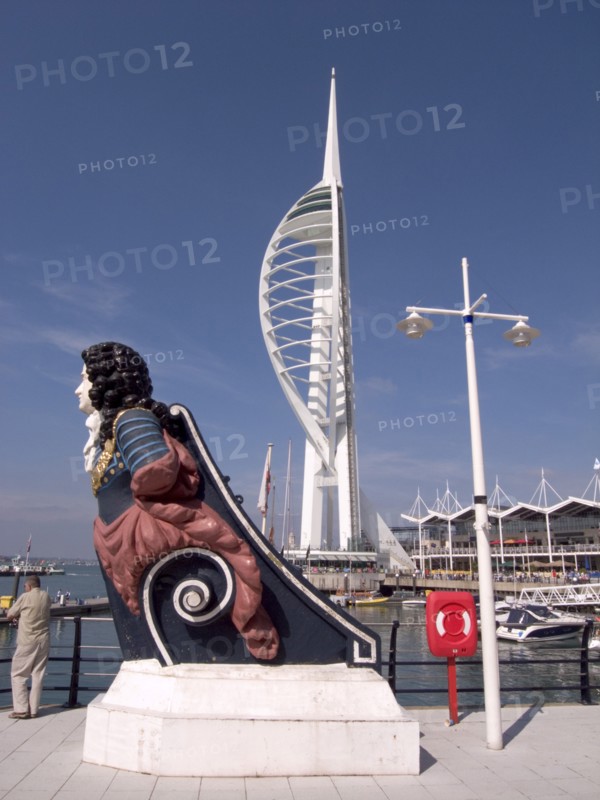 ENGLAND, Hampshire, Portsmouth, Gunwharf Quays. The Spinnaker Tower with figurehead in the foreground