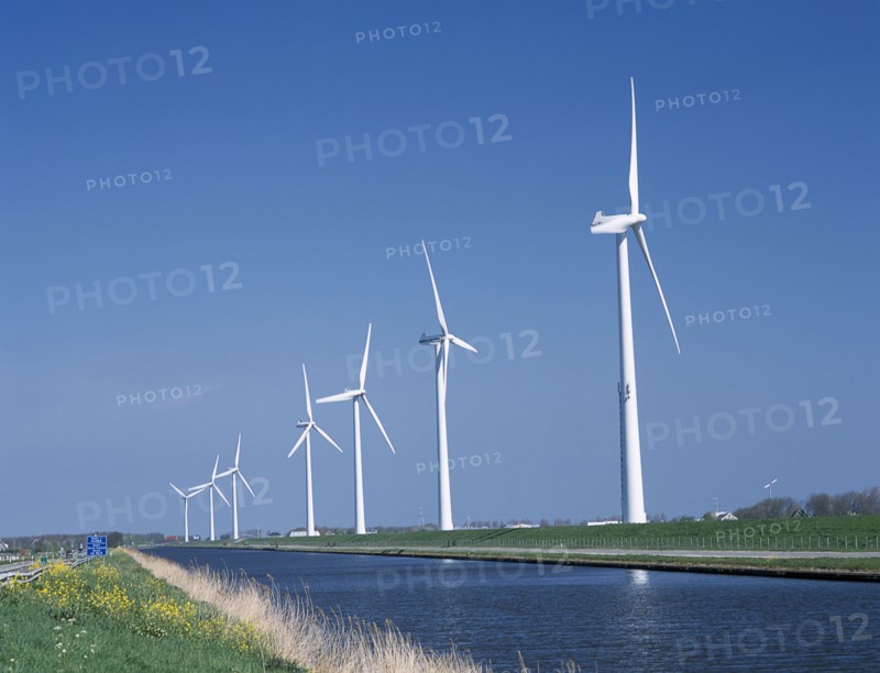HOLLAND, Noord Holland, Alkmaar, Row of Wind turbines along the Noord Hollands Kanaal north of Alkmaar