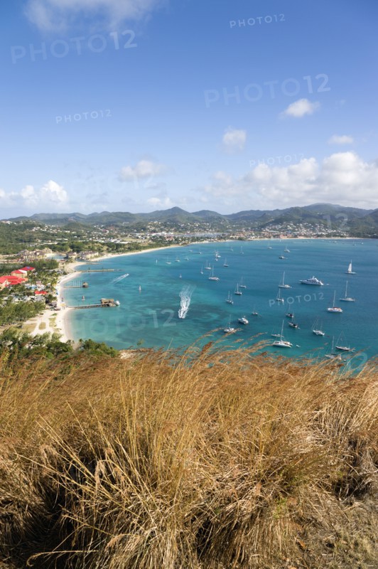 WEST INDIES, St Lucia, Gros Islet , Beach lined Rodney Bay with yachts at anchor seen from Signal Hill on Pigeon Island National Historic Park