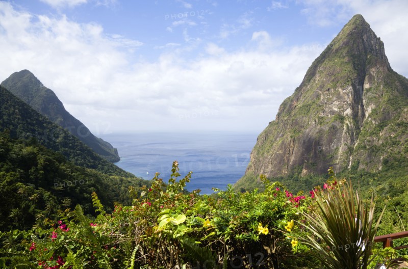 WEST INDIES, St Lucia, Soufriere , Val des Pitons The volcanic plugs of Gros Piton on the left and Petit Piton on the right with the lush valley seen from the sun deck of the Ladera Spa Resort Hotel