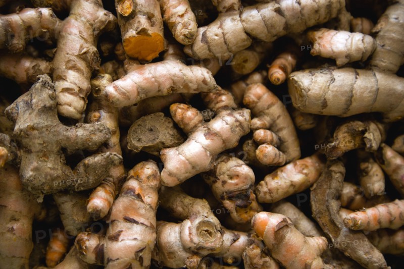 WEST INDIES, St Lucia, Castries, Market spice stall with galangal a member of the ginger family herb