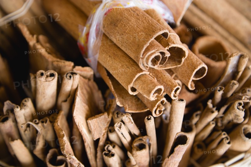 WEST INDIES, St Lucia, Castries, Market spice stall with cinnamon or cassia bark herbs tied in bundles