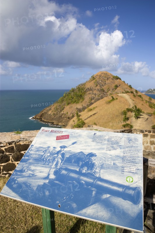 WEST INDIES, St Lucia, Gros Islet , Pigeon Island National Historic Park Signal Hill seen from Fort Rodney with an illustrated display of the fort in the 18th Century in the foreground