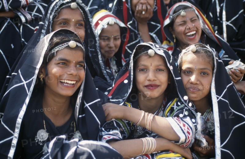 INDIA, Rajasthan, Alwar, Group of young dancers smiling and laughing at the Alwar Utsav Festival