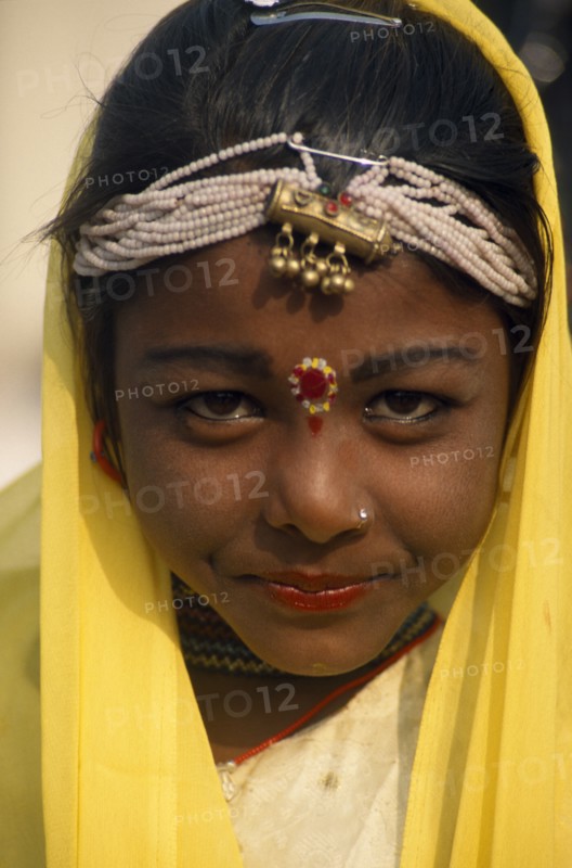 INDIA, Rajasthan, Alwar, Head and shoulders portrait of a young girl dancer at the Alwar Utsav Festival