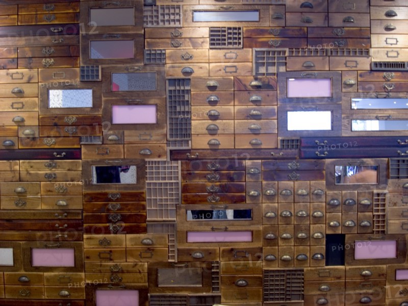 ENGLAND, Hampshire, Portsmouth, Gunwharf Quays. Shop window display of wooden draws filling the frame