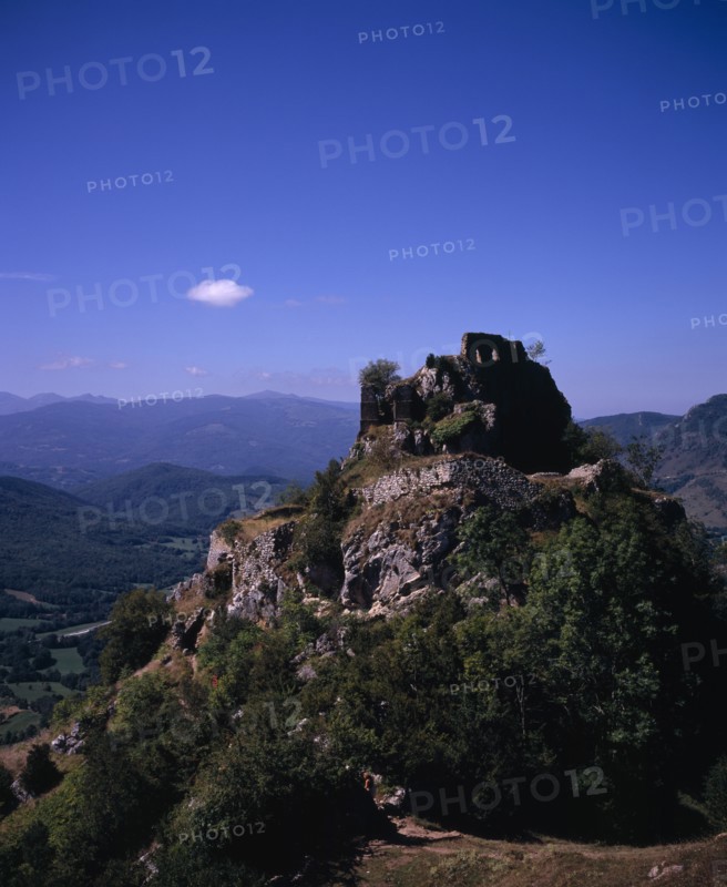 FRANCE, Midi-Pyrenees, Ariege, "Chateau de Roquefixade,  Ruined castle on cliff-top overlooking village of Roquefixade.  Site of refuge for the Cathars during the Albigensian Crusade."