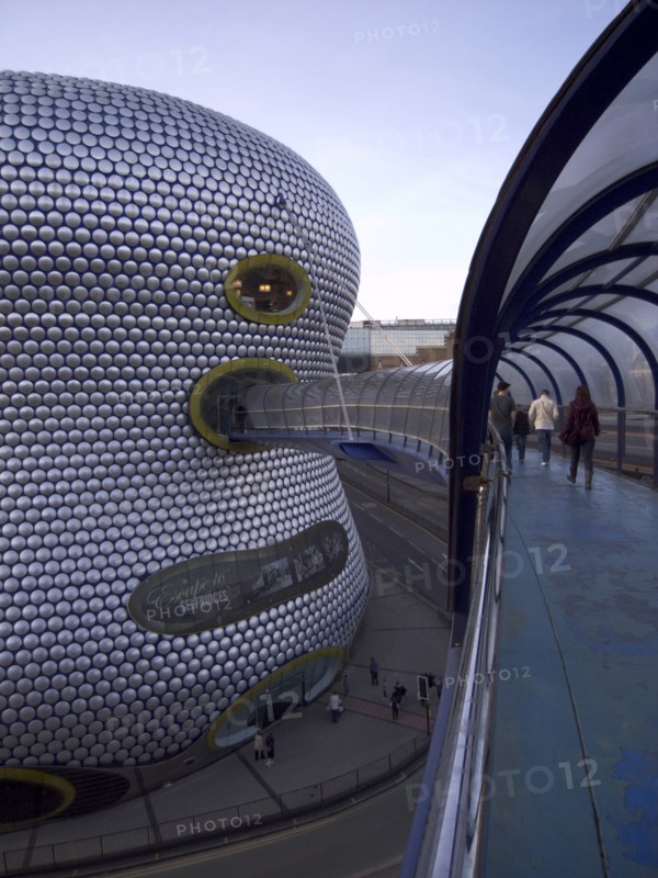 ENGLAND, West Midlands, Birmingham, Exterior of Selfridges department store in the Bullring shopping centre. People on elevated walkway to the carpark.