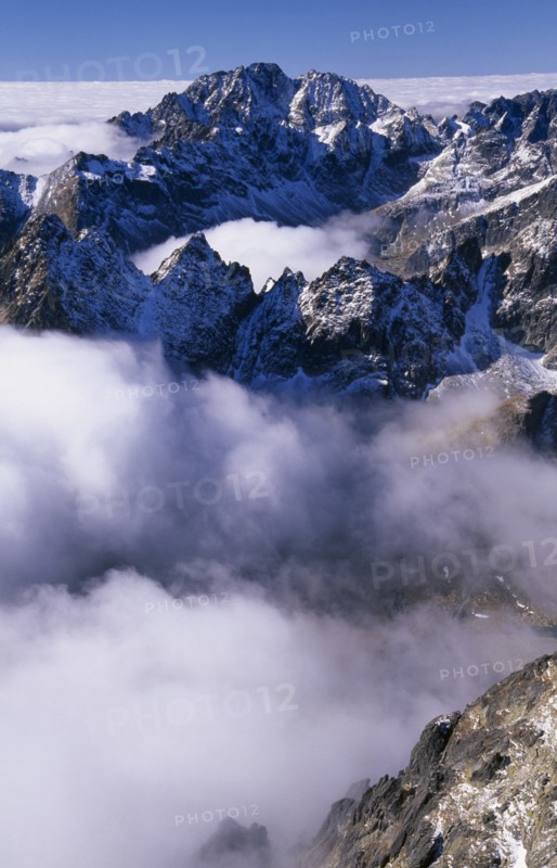 SLOVAKIA, Carpathian Mtns, High Tatras Mtns, View over snowy peaks of the High Tatras mountains above drifting cloud from the Lomnicky Stit viewpoint.