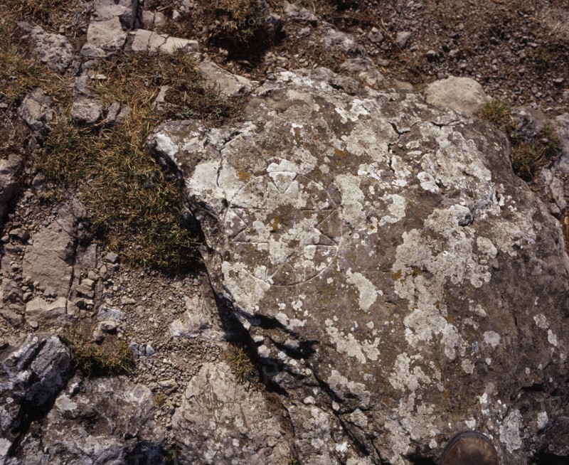 FRANCE, Languedoc-Roussillon, Aude, Pic de Bugarach (1230m).  Cathar cross cut into rock beside path to summit.  The Cathars were a religious sect  considered heretical by the Catholic church