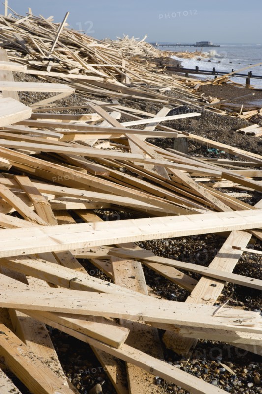 ENGLAND, West Sussex, Worthing, Timber wood planks washed up on the beach seafront from the wreckage of the Greek registered ship Ice Princess which sank off the Dorset coast on 15 January 2008. Worthin Pier in the distance