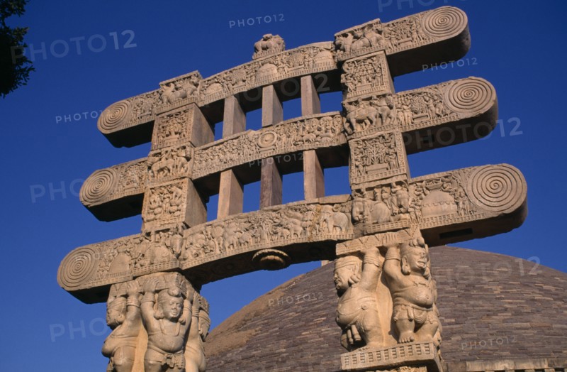 INDIA, Madhya Pradesh, Sanchi, Part view of the Great Stupa and carved gateway or torana.