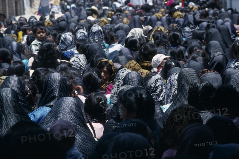 MEXICO, Oaxaca, "Crowds of women and children during Easter celebrations, many wearing black head coverings."