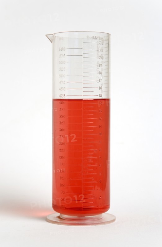 SCIENCE, Medical, Measurement, Plastic measuring beaker containing light red liquid and showing measurements in both millimeters and fluid ounces