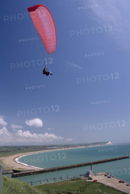 SPORT, Air, Paragliding, "Tandem paraglider above Fort Newhaven with the Mole, Lighthouse, Seaford bay and Seaford in the background."