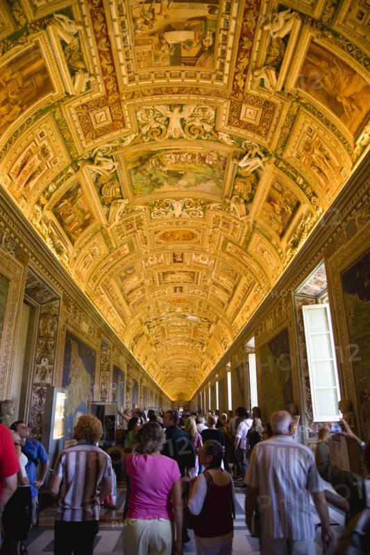 ITALY, Lazio, Rome, Vatican City Museum Tourists in the Gallery of Maps showing the illuminated ceiling and the walls lined with 16th Century cartography
