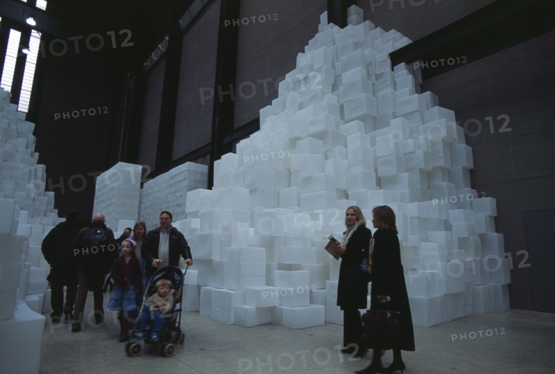 ENGLAND, London, "Tate Modern. Turbine Hall. Exhibition by Rachel Whiteread called Embankment. 14,000 transluscent white polyethylene boxes stacked in various ways. Visitors walking around."