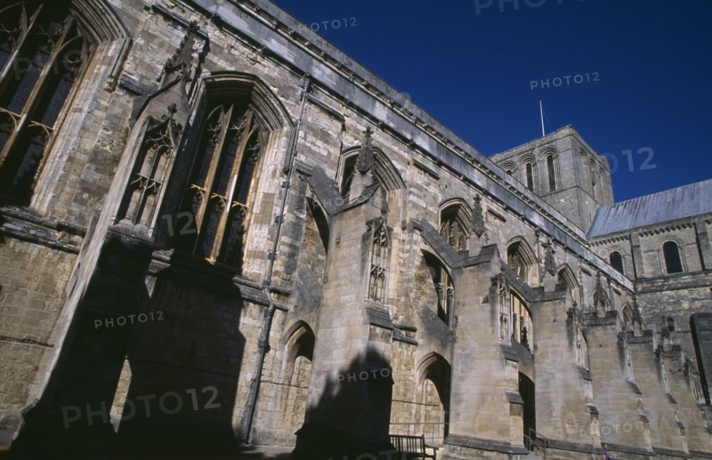 ENGLAND, Hampshire, Winchester, Winchester Cathedral. Angled part view of exterior