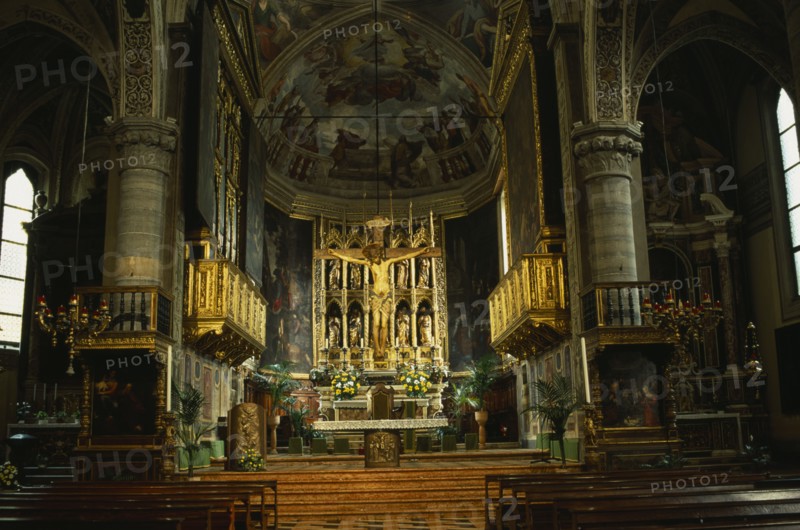 ITALY, Lombardy, Lake Garda, "Salo.  Interior of the Duomo with ornate golden altarpiece, crucifix and painted walls and vaulted ceiling."