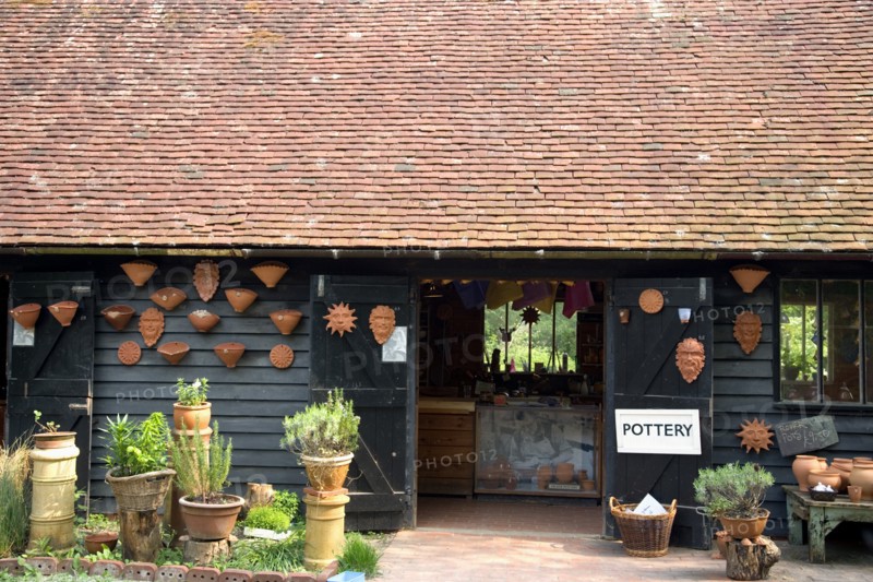 ENGLAND, West Sussex, Amberley, Amberley Working Museum. Pottery building with examples of clay work on display