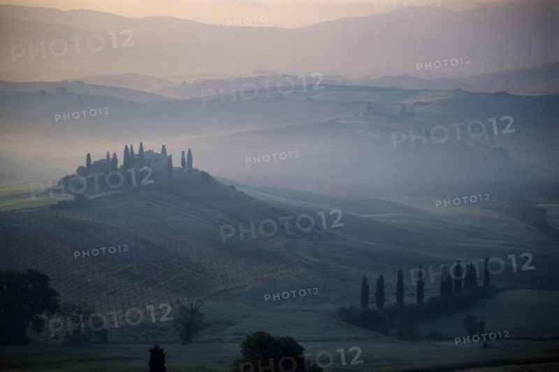 ITALY, Tuscany, San Quirico, View over The Belvedere in early morning mist