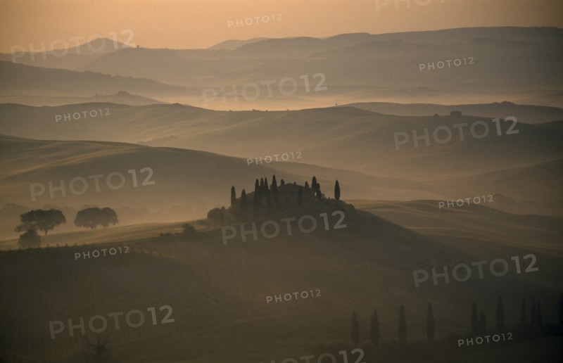 ITALY, Tuscany, San Quirico, View over The Belvedere in early morning mist
