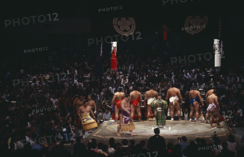 JAPAN, Samurai, Sumo, Sumo wrestlers of the top division perform the dohyo-iri ring entry ceremony before crowd of spectators before a Grand Championship fight.