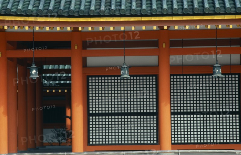 JAPAN, Honshu, Kyoto, "Exterior detail of the Heian shrine, built in 1895 to celebrate the 1100th anniversary of the founding of the city.  Its buildings are a replica on a reduced scale of the first Imperial Palace built in 794.  Red pillars, green roof tiles and hanging lanterns."