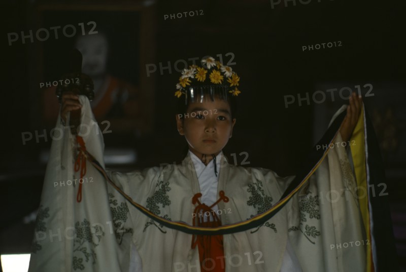 JAPAN, Kyushu, Kaseda Shrine, "Portrait of young shrine maiden employed to welcome visitors, supervise offerings and perform sacred dances for the Shinto gods or kami."