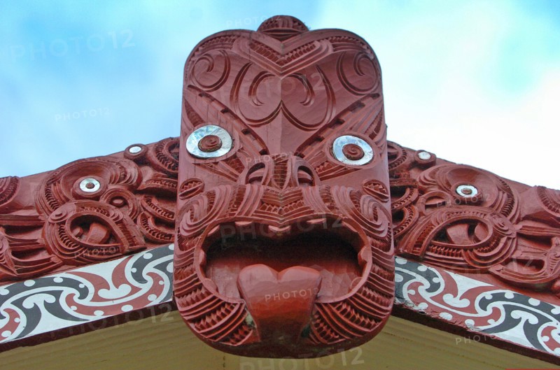 NEW ZEALAND, NORTH ISLAND, ROTORUA, "CENTRAL CARVING OF A MAORI MEETING HOUSE OR WHARENUI WHERE THE TRIBE MET AT TE PUIA MAORI ARTS AND CRAFTS INSTITUTE, ROTORUA."