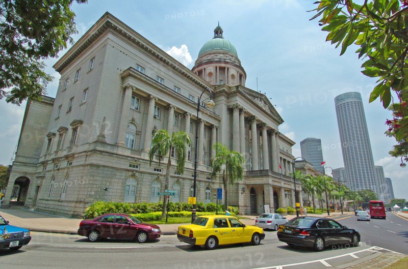 SINGAPORE, OLD SUPREME COURT, "VIEW OF THE OLD SUPREME COURT BUILDING ON THE CORNER OF PARLIMENT PLACE AND ST ANDREWS ROAD. The Old Supreme Court Building is the former courthouse of the Supreme Court of Singapore, before it moved out of the building and commenced operations in the new building on 20 June 2005. The building was the last Classical architecture building to be built on the former British colony. Built in front of the historical Padang grounds between 1937 and 1939, it was designed by Frank Dorrington Ward of the Public Works Department, and was his last and most significant work. The building is planned to become an arts and cultural centre in future, with plans to refurbish the building"