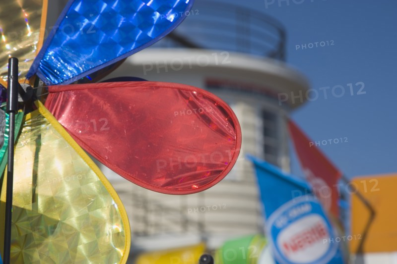 ENGLAND, West Sussex, Worthing, Colourful wind vain against a blue sky on seafront