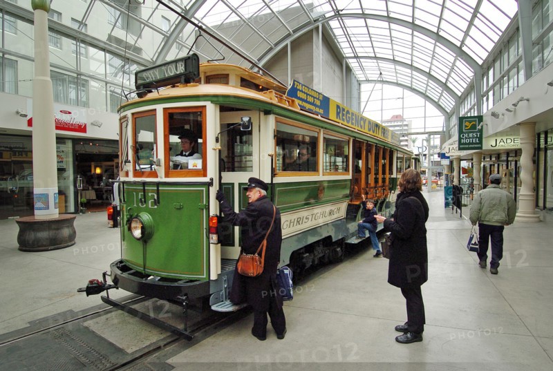 NEW ZEALAND, SOUTH ISLAND, CHRISTCHURCH, "CANTERBURY, CITY TOUR TRAMS AT A TRAM STOP IN WORCESTER STREet."