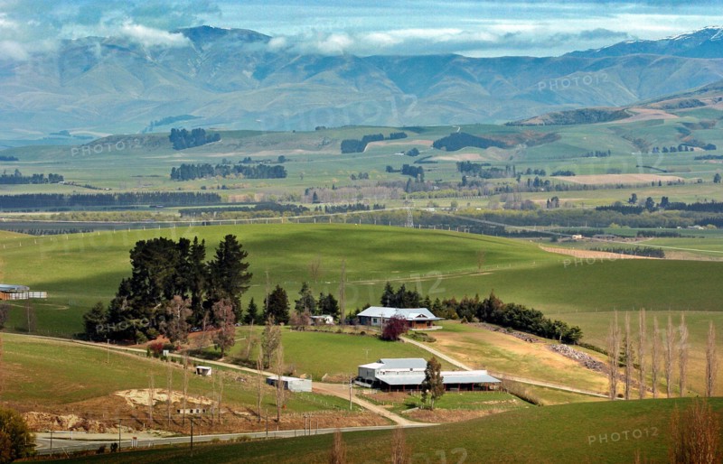 NEW ZEALAND, SOUTH ISLAND, FAIRLIE, "CANTERBURY, VIEW WEST FROM MOUNT MICHEAL ACROSS THE FARMIMG PLAINS OF MACKENZIE COUNTRY FROM ROUTE 79 TOWARDS THE TOWN OF FAIRLIE."