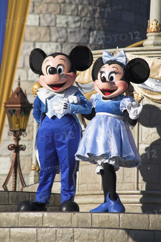 USA, Florida, Orlando, Walt Disney World Resort. Mickey and Minnie Mouse characters on stage in the Magic Kingdom.