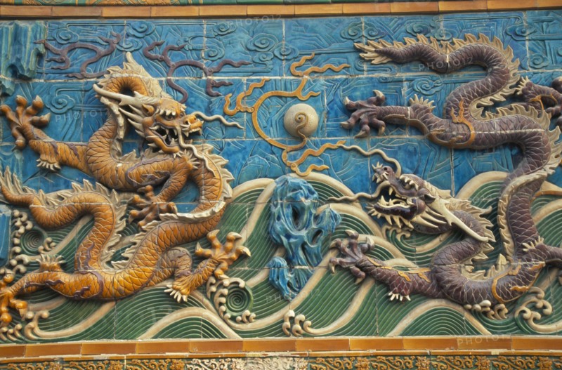 CHINA, Beijing, "Beihai Park.  Detail of Nine Dragon Screen constructed from coloured, glazed tiles and originally used to give protection from evil spirits to temple (now disappeared)."