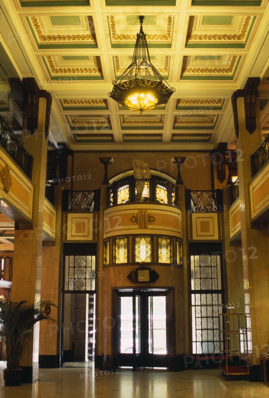 CHINA, Shanghai, "Peace Hotel.  Interior of foyer with marble floor, upper balcony and revolving door at entrance."