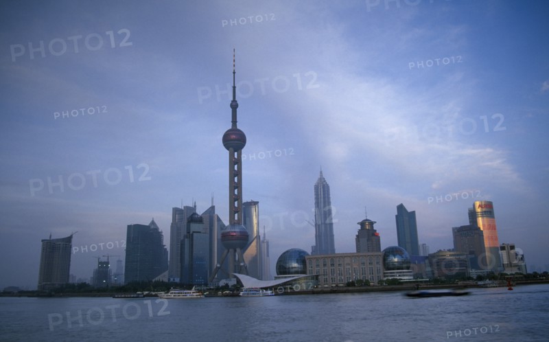 CHINA, Shanghai, Pudong skyline at dusk with skyscrapers including the Oriental Pearl Tower and the Jin Mao Building.
