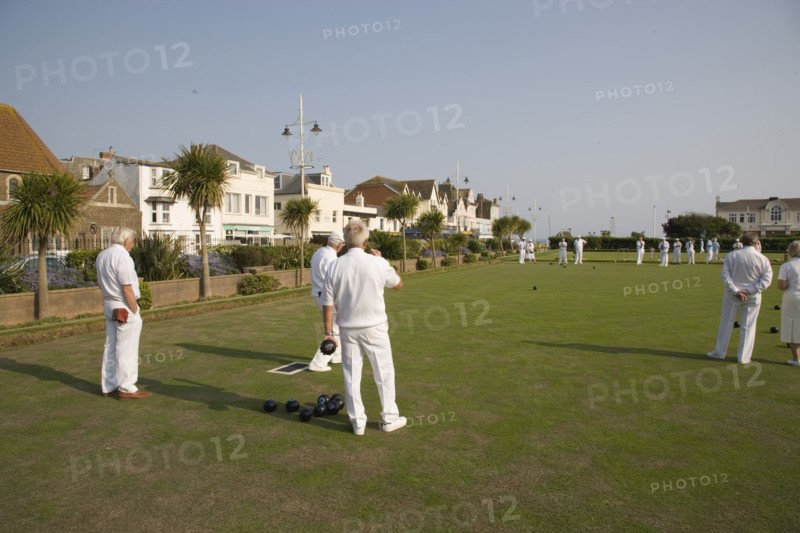 ENGLAND, West Sussex, Bognor Regis, Men playing a game of bowls on green