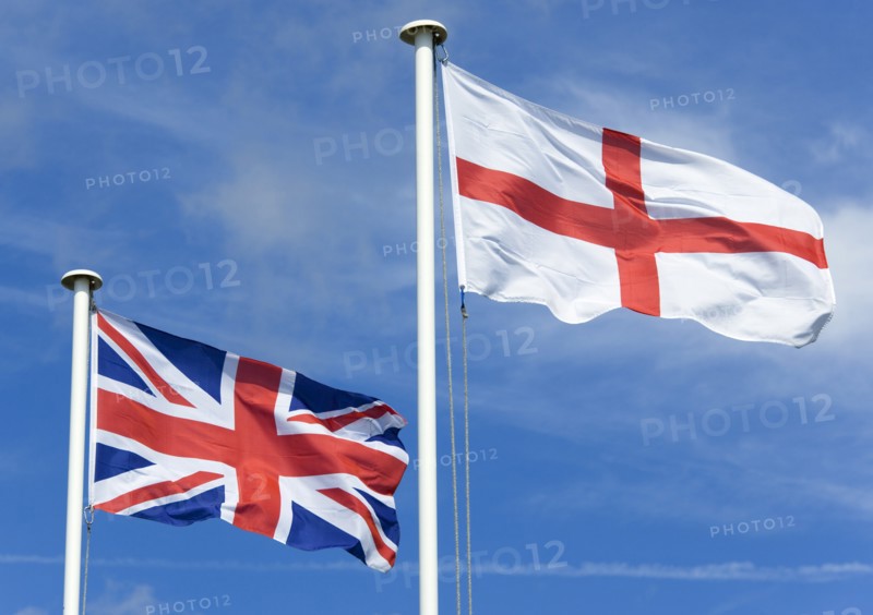 ENGLAND, West Sussex, Littlehampton, Flagpoles with the English flag of Saint George on the right with the Union Flag or Union Jack of Great Britain on the left