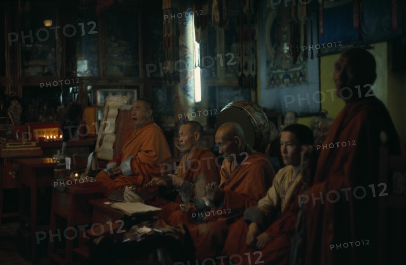 MONGOLIA, Ulan Bator, "Ulan Bator Buddhist temple, the only one the Russian dominated Mongol government allowed to exist and be used for worship (in 1970's) Buddhist monks praying in low natural light. "