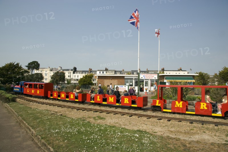 ENGLAND, West Sussex, Littlehampton, Families enjoying the Miniature Railway train ride at Norfolk Gardens.