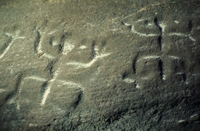 COLOMBIA, North West Amazon, Tukano Indigenous People, "Barasana.  Detail of rock engravings depicting ancient dancing animal spirits, in old red sandstone strata et edge of rio Piraparana. Tukano sedentary tribe North Western Amazonia American Colombian Columbia Hispanic History Indegent Latin America Latino South America Tukano"