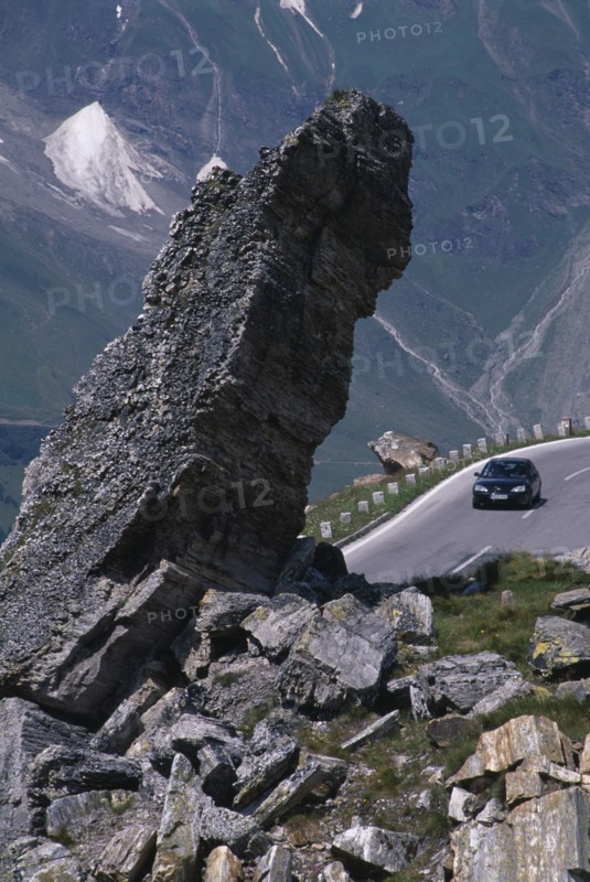 AUSTRIA, Hohe Tauern, High Tauern N. Park, Witches Kitchen rock formation above car on Grossglockner Road in mountain range forming part of the Eastern Alps.