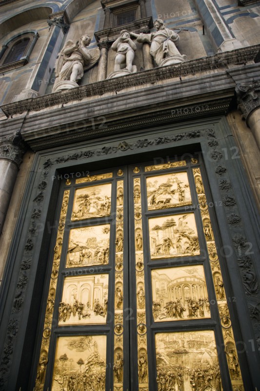 ITALY, Tuscany, Florence, "The 15th Century East Doors of the Baptistry of the Cathedral of Santa Maria del Fiore, the Duomo. The panels are by the artist Lorenzo Ghilberti, and were dubbrd the Gate Of Paradise by Michelangelo"