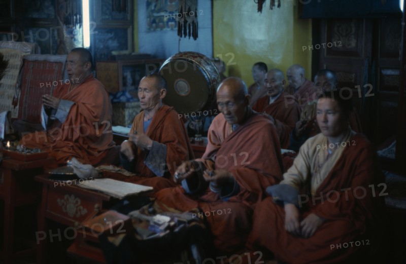 MONGOLIA, Ulan Bator, Buddhist monks in Ulan Bator's only temple allowed by the authorities in 1974. They chant and pray in low lit temple interior in trance like state. Ulaanbaatar East Asia Asian Baator Mongol Uls Mongolian Religion Religion Religious Buddhism Buddhists Ulaan