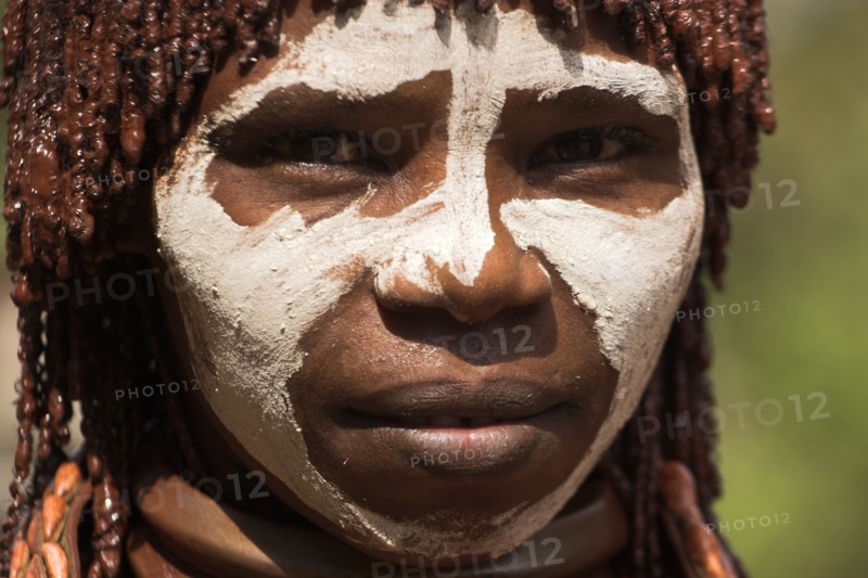 ETHIOPIA, Omo Valley, Mago National Park, "Banna woman, her hair greased with ocher colouring and animal fat into plaits known as Goscha  Jane Sweeney "